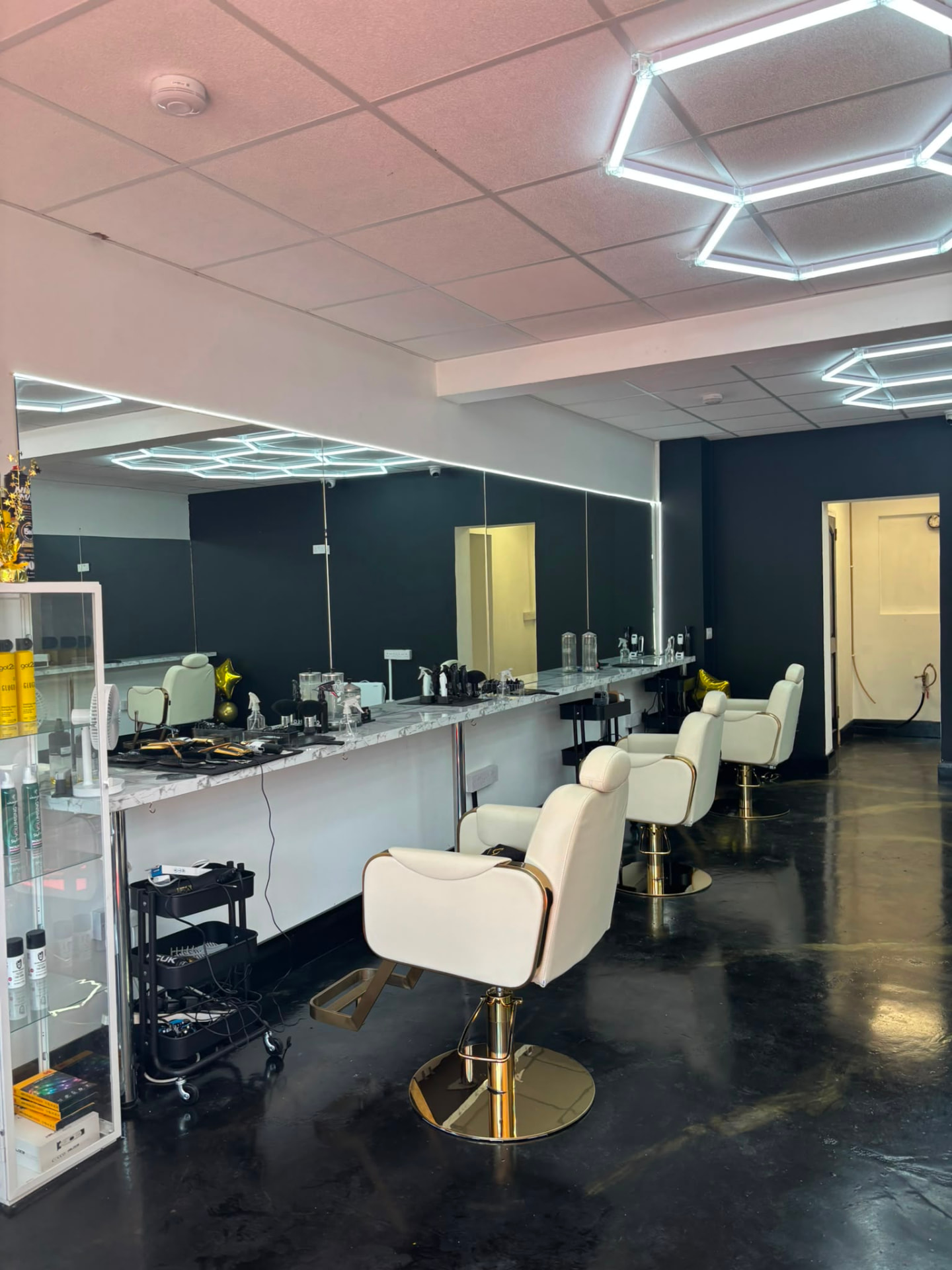 The interior of Curly's Barbershop in Santry, Dublin 9 with barber chairs and mirrors